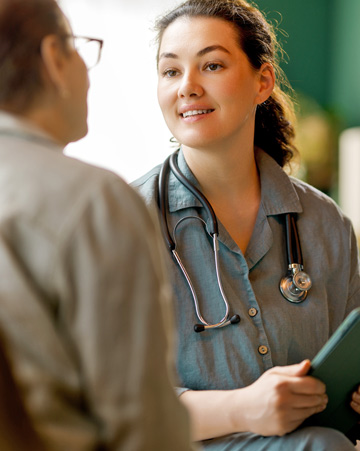 Female patient and a doctor talking in hospital
