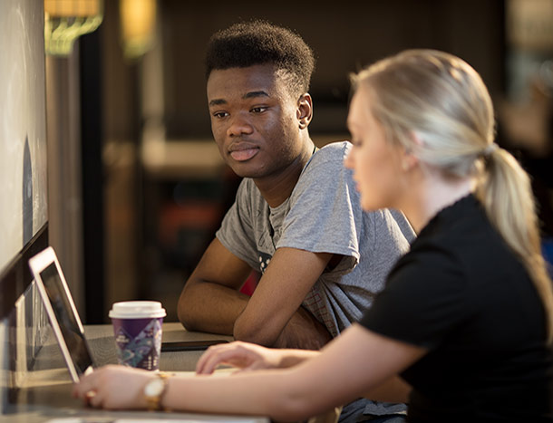 Students on laptop in 123 St Stephens Green basement