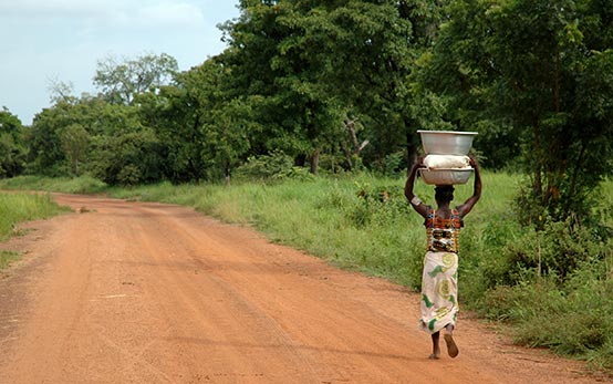 Boy carrying water in Africa