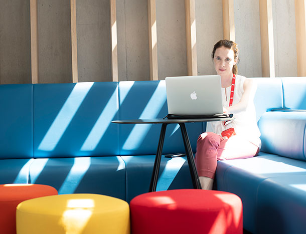 RCSI staff member on blue couch