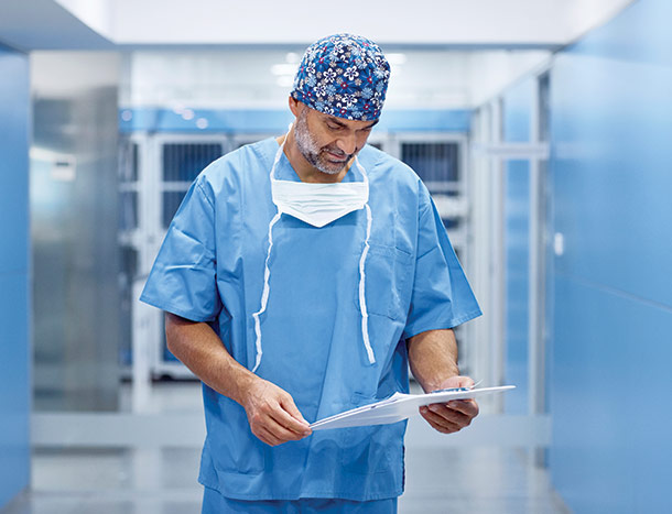Male surgeon walking