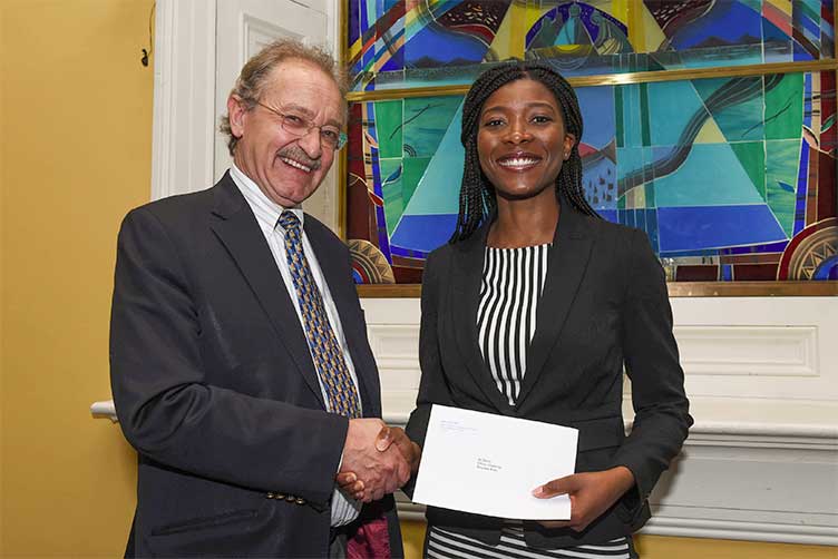Professor David Smith, Associate Professor of Healthcare Ethics at RCSI presents the 2017/18 Ethics Challenge prize to medical student Moyowa Boyo 
