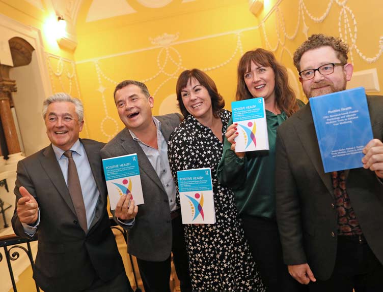A group poses for the Positive Health book launch