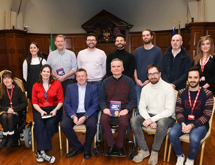 Closer to Walking Again Group shot of individuals in an college hall