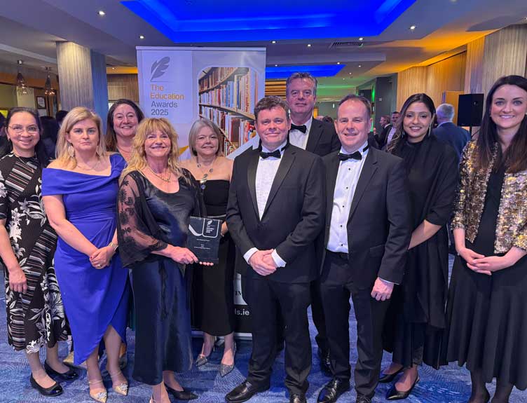 Group poses with award at event