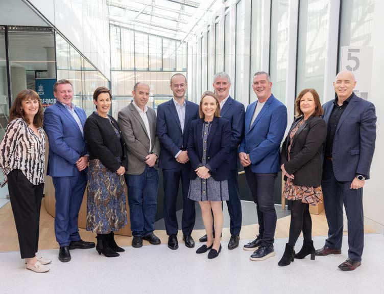 Entrepreneur in Residence A large group pose in well-lit building during launch of new Entrepreneur in Residence programme