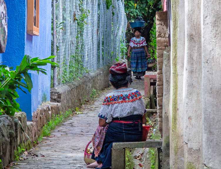Person carrying items on head in Africa