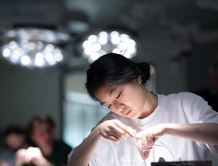 Surgical Bootcamp Young student participates in a surgical simulation