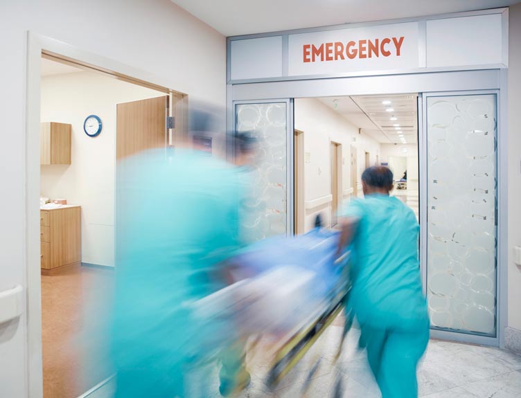 Motion shot of nurses moving patient to emergeny department