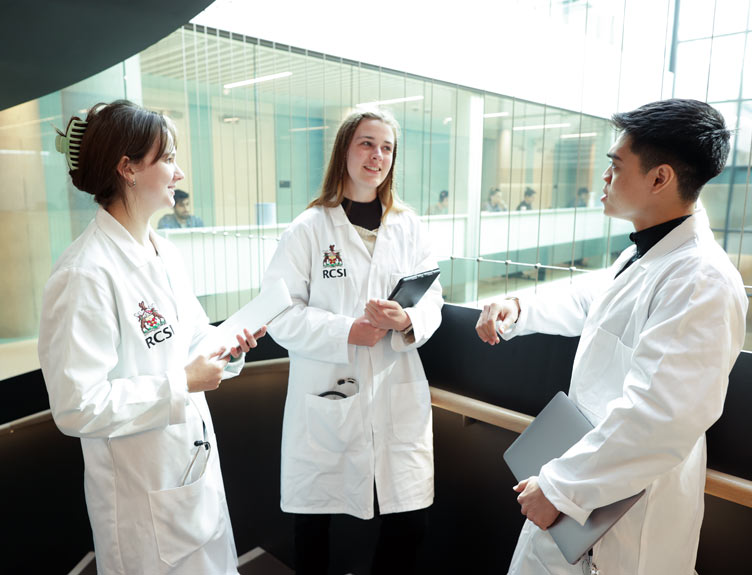 Undergraduate students in white coats