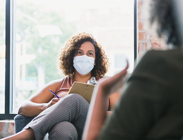 Counselling session with participants wearing facemasks