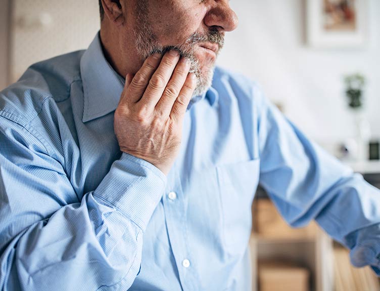 Toothache or decision for an elderly businessman