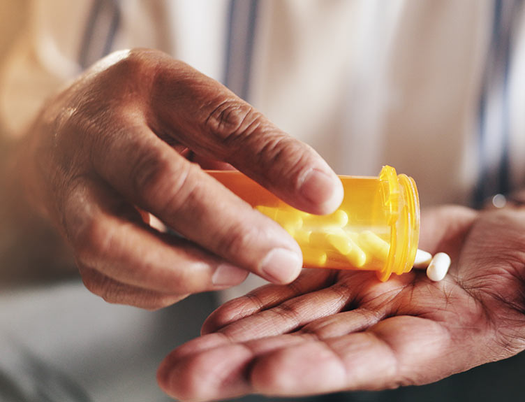 Hands, pills and bottle in closeup for person with drugs