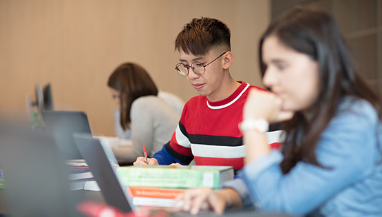 Postgraduate students in Library study room