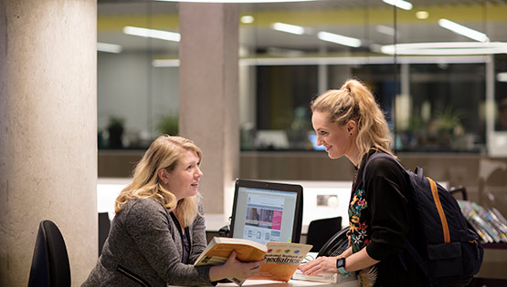 RCSI Library staff member with student