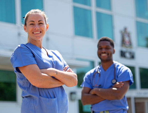 Two medical professional pose