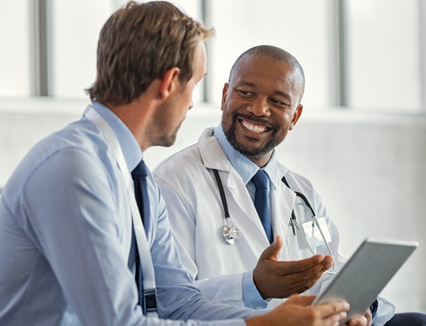 Two medical professionals in dialogue
