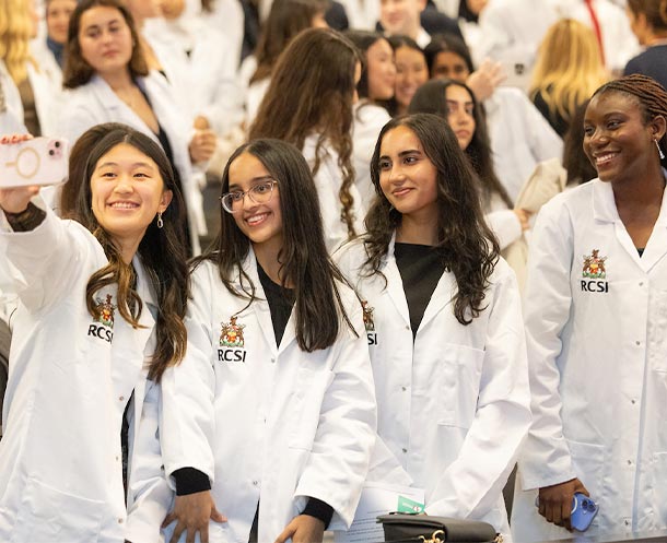 Students taking selfie at RCS White Coat Ceremony