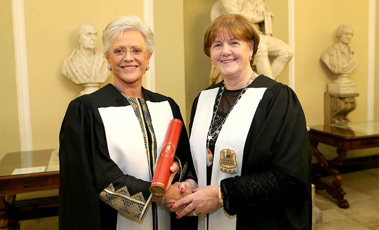Her Royal Highness Princess Muna Al-Hussein of Jordan conferring