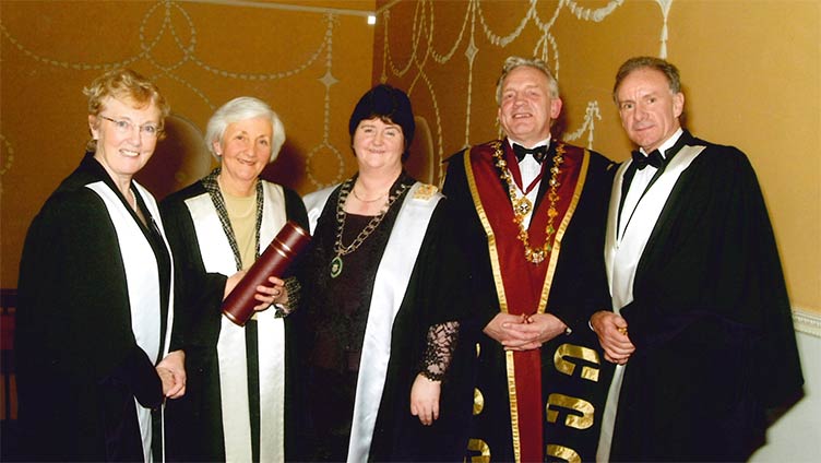 Therese Meehan conferring