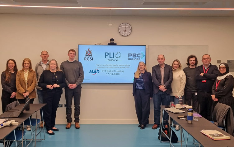 Large group in classroom setting with visual projector