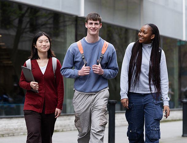 Three students walking past the RCSI buildings on York Street, Dublin
