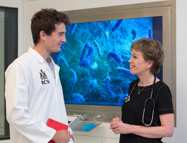 Clinician and student talking