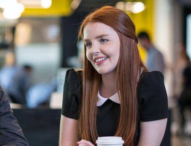 A student smiles in university setting
