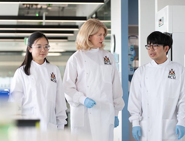 RCSI PI with two postgraduate students in lab environment