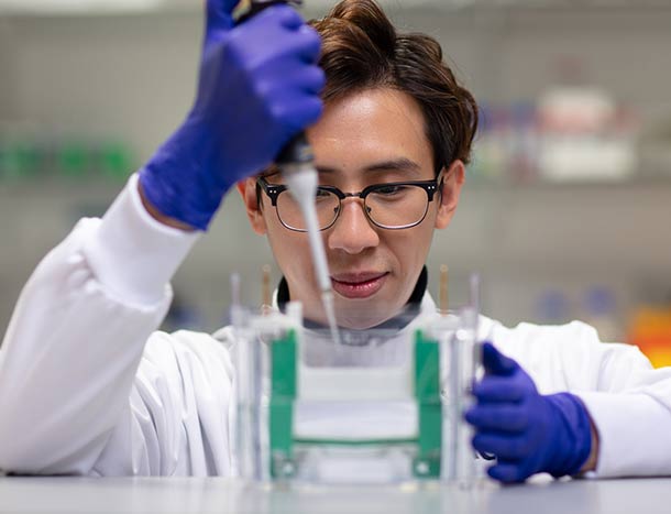 RCSI researcher pipetting