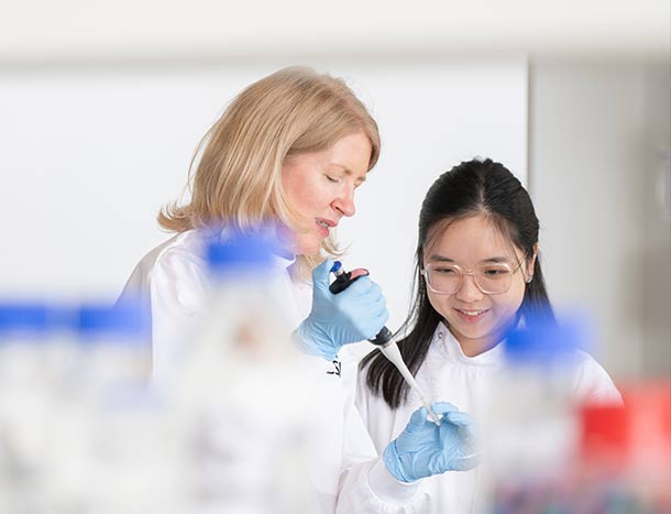 RCSI tutor with postgraduate student in laboratory