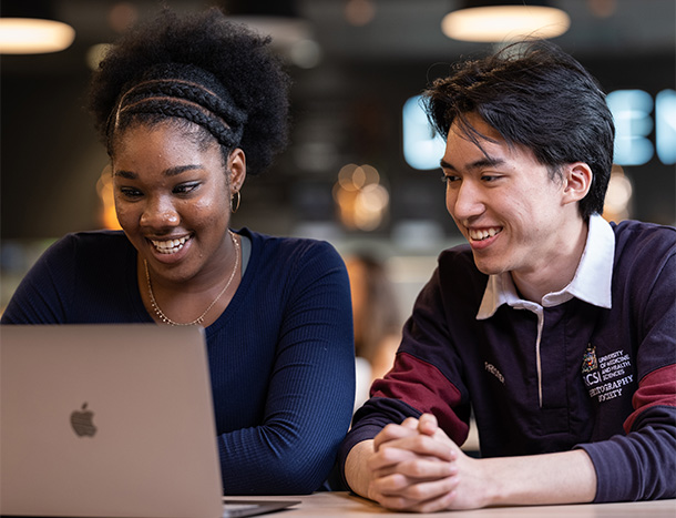 RCSI students looking at laptop