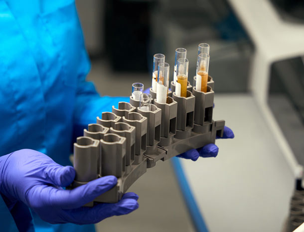 Specialist with test tubes with biomaterial for analysis in hands 