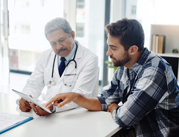 Doctor discussing file with patient