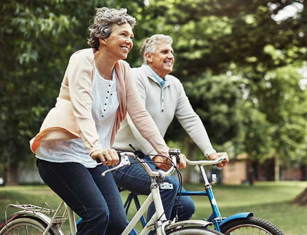 Person looks at phone while taking notes surrounded by healthy food