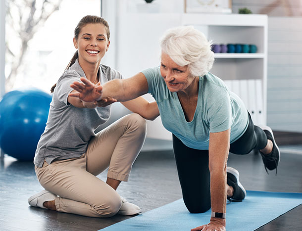 Older woman and physiotherapist