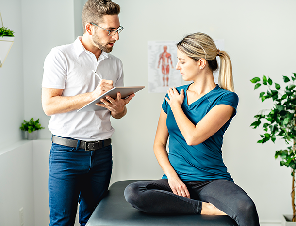 Patient showing physiotherapist shoulder injury