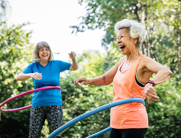 Senior ladies using hula hoops