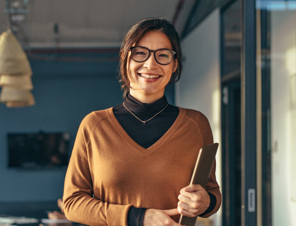 Smiling business woman in casuals at office