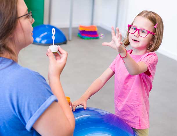 Young girl and physiotherapist