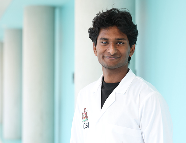 Headshot of Anil Sivakumar, RCSI GEM student in a white coat. 