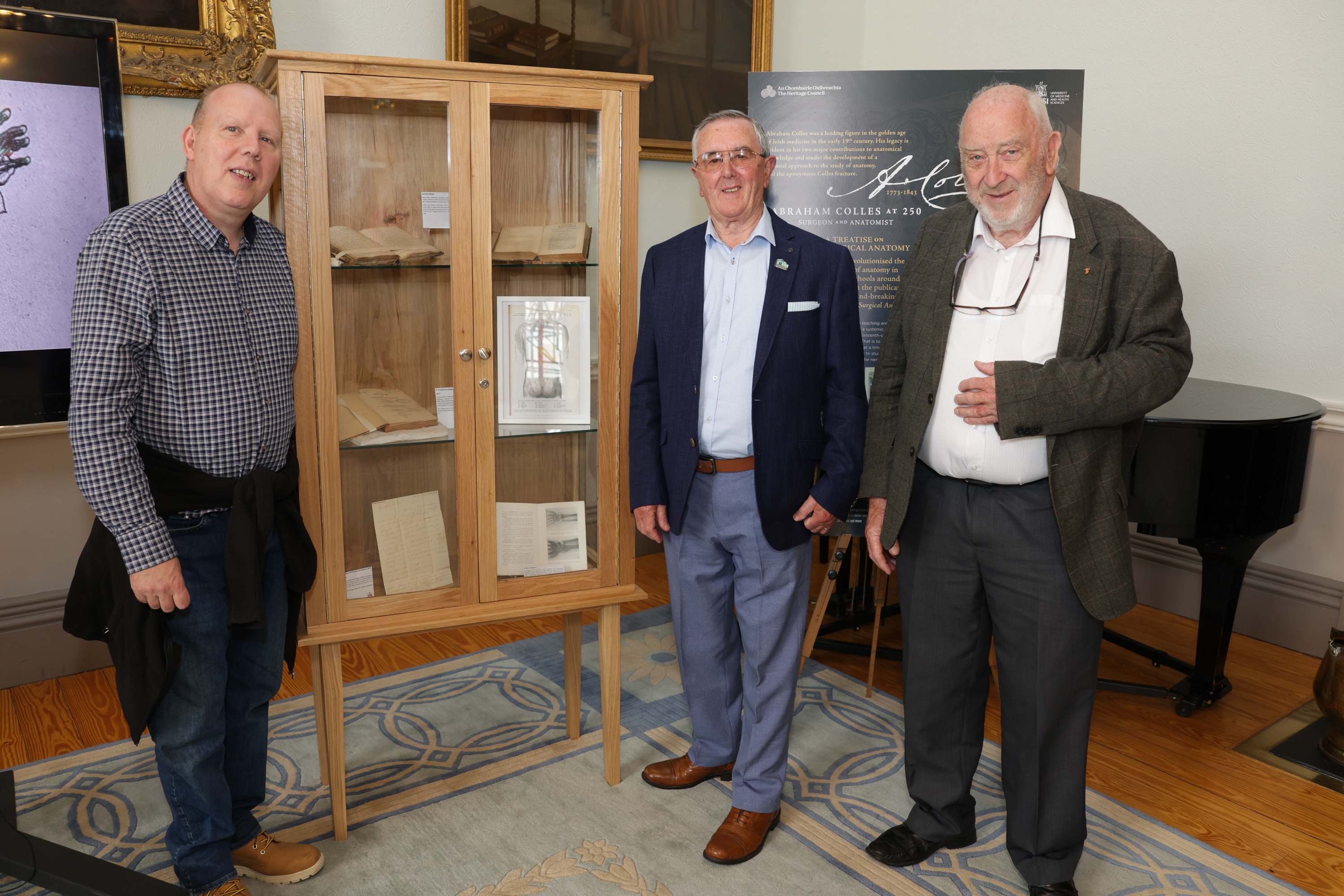 Members of Clondalkin Men's Shed crafted bespoke display cabinets for RCSI's Colles at 250 celebration.