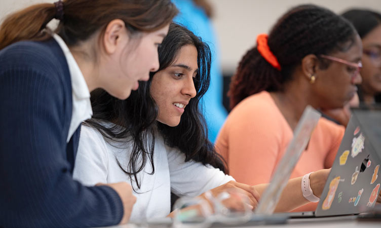 Students collaborate together in class