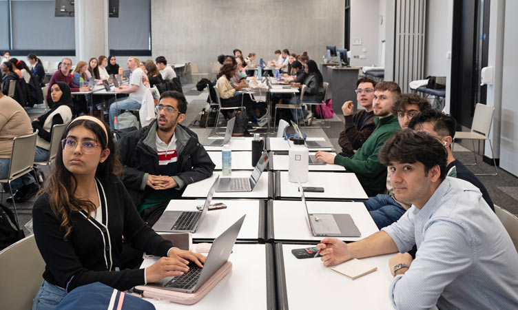 Group of students pay attention in classroom