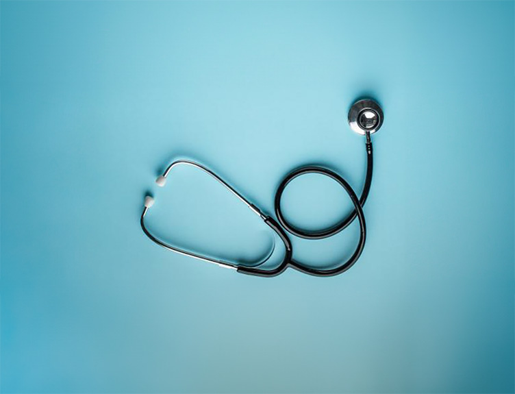 A stethoscope on a blue background.