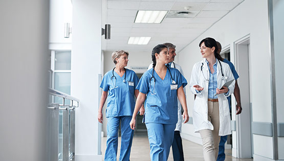 Group of healthcare professionals in hospital corridor
