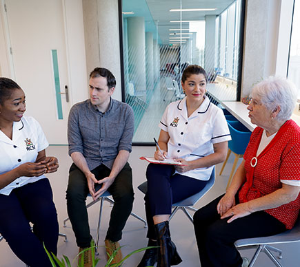 nurses and patients in conversation