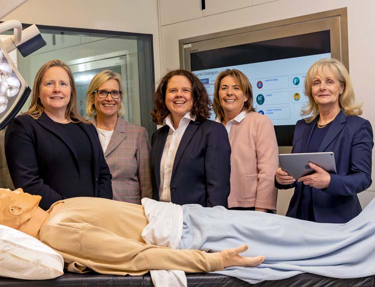 Five individuals pictured at the launch of the e-learning module in the RCSI’s state of the art simulation suite