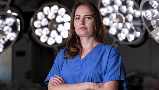PROGRESS Women in Surgery Fellowship 2025 recipient, Lauren O'Connell, pictured in blue scrubs