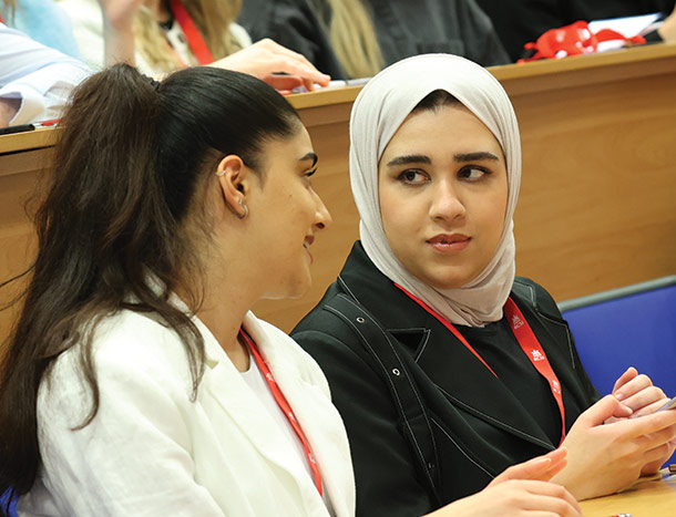Young medical professionals in lecture theatre